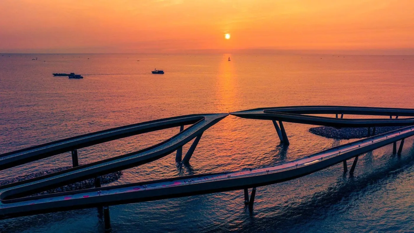 Sunset over a coastal bridge in Vietnam