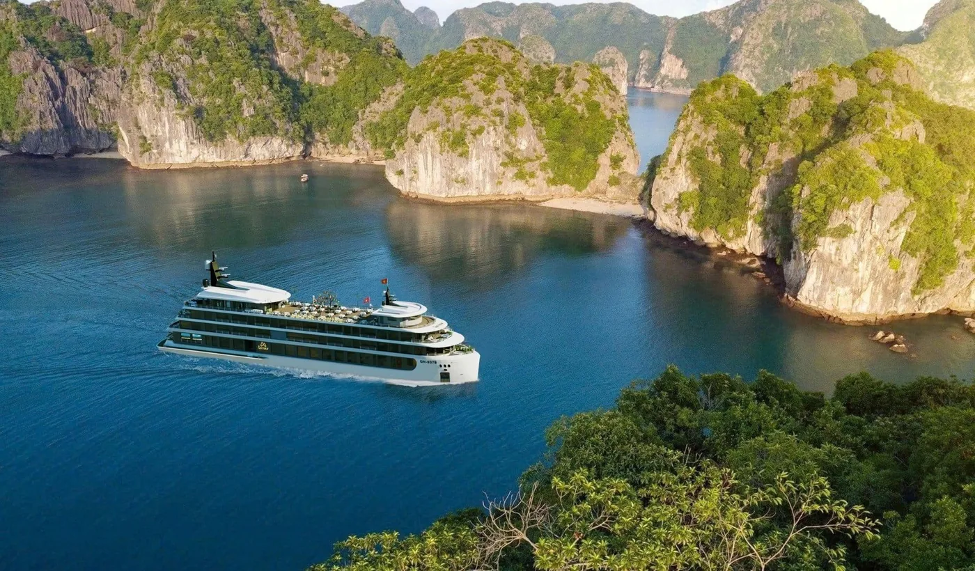 Cruise ship sailing through Ha Long Bay