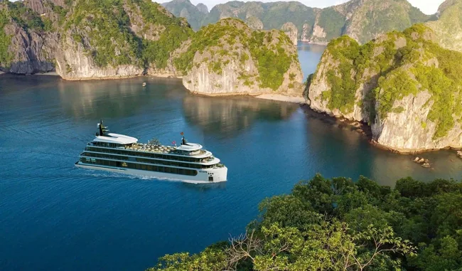 Cruise ship sailing through Ha Long Bay